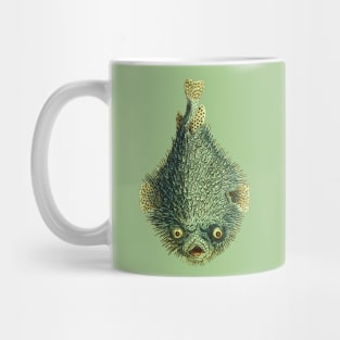 Spiky porcupinefish, green and mean looking with creepy yellow eyes. Mug